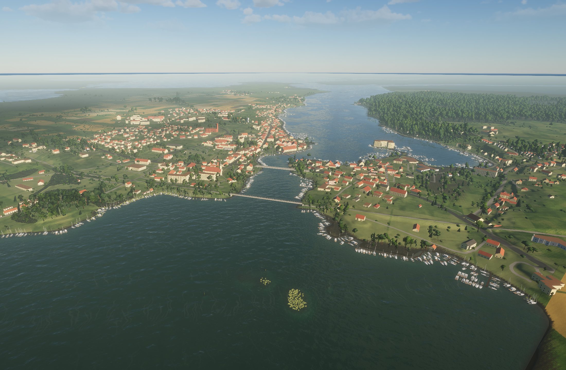 The lake from the air in the game: Mikołajki on the narrows, Lake Tałty beyond it and Lake Mikołajskie in front